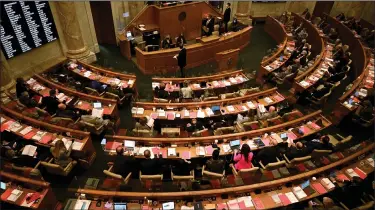  ?? (Arkansas Democrat-Gazette/Stephen Swofford) ?? Members of the Arkansas House vote on a bill Monday. The Legislatur­e is in recess until at least midweek because of expected inclement weather.