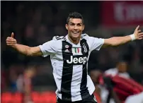  ?? — AFP ?? Juventus striker Cristiano Ronaldo celebrates his goal against AC Milan in San Siro on Sunday night.