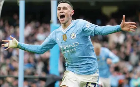  ?? ?? Phil Foden scores twice as City came back from behind to beat United in the Manchester Derby on Sunday evening at the Etihad Stadium on Sunday afternoon