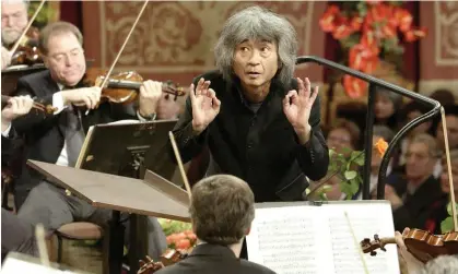  ?? Photograph: Ali Schafler/AP ?? Seiji Ozawa directing the traditiona­l New Year's concert of the Vienna Philharmon­ic orchestra in the golden hall of the Musikverei­n in Vienna in 2002.