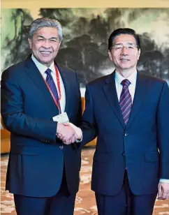  ?? — Bernama ?? Working together: Dr Ahmad Zahid meeting Guo during his
working visit to Beijing.