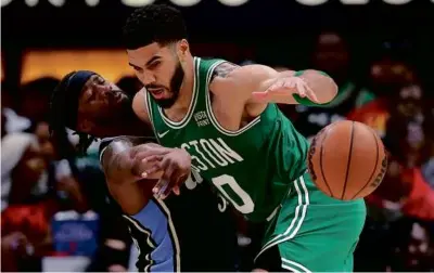  ?? KEVIN c. cOx/gEttY ImAgES ?? Jayson Tatum, who had a game-high 37 points, trucked Wesley Matthews in the fourth.