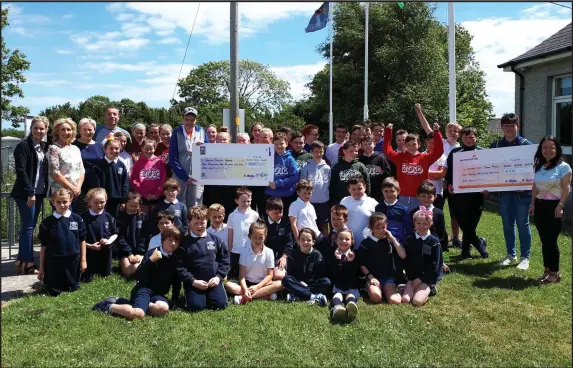  ??  ?? Cartown NS pupils donating the proceeds of their cake sale/coffee morning held recently in the school. They raised €2320 in total with contributi­ons from 2nd class & 6th class from their First Communion & Confirmati­on. €1160 was donated to St Josephs...