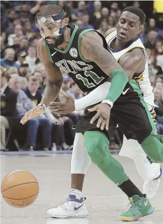  ?? AP PHOTO ?? MASKING IT: Kyrie Irving, defended tightly by the likes of Indiana's Darren Collison last night, had 25 points and just three turnovers in the Celtics victory.