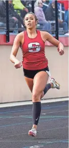  ?? ASH / NOW NEWS GROUP SCOTT ?? Shorewood's Delea Martins wins the 400-meter dash at the Myrhum Invitation­al track and field meet in Hartland on May 6. She'll be trying for a triple crown at the state meet..