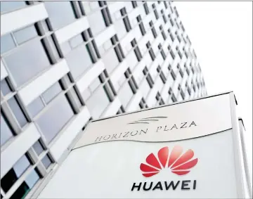  ??  ?? Logo of Huawei is seen in front of the local offices of Huawei in Warsaw, Poland. — Reuters photo