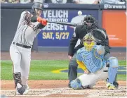  ?? ?? BIG HIT: Giants catcher Patrick Bailey hits an RBI single during the second inning at American Family Field.