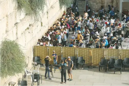  ?? (Marc Israel Sellem/The Jerusalem Post) ?? SOME 200 Reform and Conservati­ve leaders and activists will walk to the Western Wall plaza entrance carrying 10 Torah scrolls, with the intention of entering the site, whose packed women’s section is shown here.