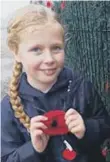  ?? ?? Ten year-old Masie Mead from Plymouth, with her Poppy.