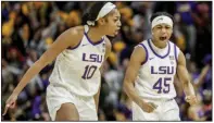  ?? (AP/Derick Hingle) ?? LSU guard Alexis Morris (45) and forward Angel Reese celebrate following a basket against Georgia in overtime Thursday in Baton Rouge. Reese had game highs of 23 points and 14 rebounds, and Morris added 15 points in an 82-77 victory.