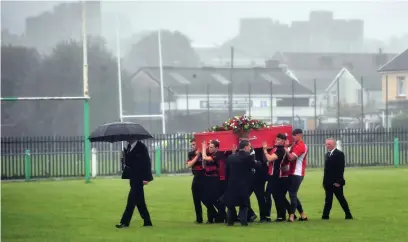  ?? ROB BROWNE ?? Owen Bennett’s coffin is carried on to the pitch at Caerphilly Rugby Club