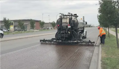  ?? CITY OF REGINA ?? The City of Regina is piloting a new pavement preservati­on project that it hopes will reduce cracks and potholes while also saving money.