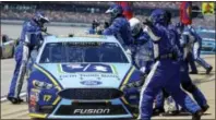  ?? BUTCH DILL — THE ASSOCIATED PRESS ?? Ricky Stenhouse Jr. (17) pits during the Camping World 500 auto race at Talladega Superspeed­way, Sunday in Talladega, Ala.