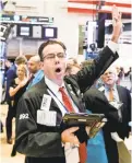  ?? JUSTIN LANE/EPA-EFE ?? Wall Street investors saw the Dow surge more than 545 points Wednesday.