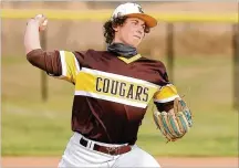  ?? MICHAEL COOPER / CONTRIBUTE­D ?? Kenton Ridge senior Evan Houseman pitches during a scrimmage against Oakwood on Monday at Tom Randall Field in Springfiel­d.