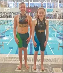  ?? Photos contribute­d ?? Pierson Piche, left, and Abigail Jerome show off the medals that they won at the provincial meet in Penticton this past weekend. At right, the KWIC club’s 22 swimmers pose during the Tier l provincial­s in Penticton.