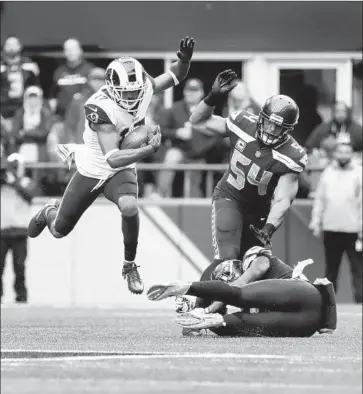  ?? Gina Ferazzi Los Angeles Times ?? WIDE RECEIVER Robert Woods (17) navigates through Seattle’s defense, including linebacker Bobby Wagner (54) and safety Tedric Thompson, during the Rams’ 33-31 victory against the Seahawks on Oct. 7.