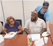  ??  ?? Marvin Jones serves an example of a healthy breakfast to Rickey McCaskill. Jones works for Grand Ballroom of Cudahy. The meal had a 3-ounce serving of grits, an egg, two broiled turkey sausage links and strawberri­es. The only added salt to the meal...