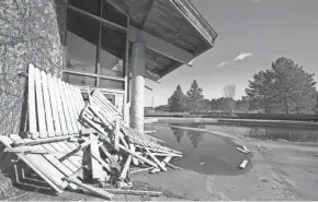  ?? MIKE DE SISTI/MILWAUKEE JOURNAL SENTINEL ?? Discarded lumber from fencing sits outside the old Telemark Lodge near Cable on April 16, 2021. The lodge has been closed since 2013 and its new owners, the American Birkebeine­r Ski Foundation, began demolishin­g it in April.