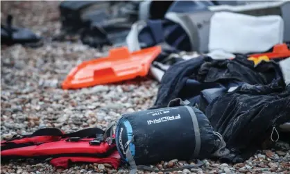  ?? Photograph: Mohammed Badra/EPA ?? Remains of an inflatable boat and personal belongings left on the beach near Wimereux, France.