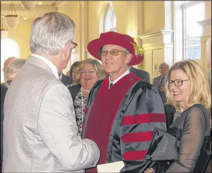  ?? WENDY ELIOT ?? Dr. Peter Ricketts with his wife, Maryann, greeted a long line of well wishers at the reception followig the installati­on.