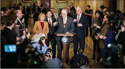  ?? The New York Times/ERIN SCHAFF ?? Senate Minority Leader Charles Schumer speaks at a news conference Tuesday, along with Democratic Senate colleagues. Schumer met earlier Tuesday with Senate Majority Leader Mitch McConnell, who said that “we’re on the way to getting an agreement” on a...