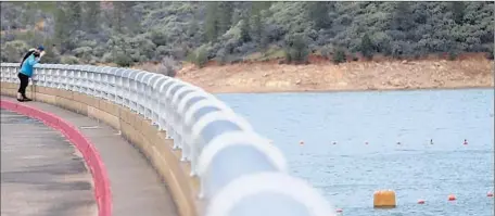  ?? Andreas Fuhrmann Associated Press ?? OFFICIALS recently dumped thousands of cubic feet of water from the Shasta Reservoir because it was in danger of overflowin­g.