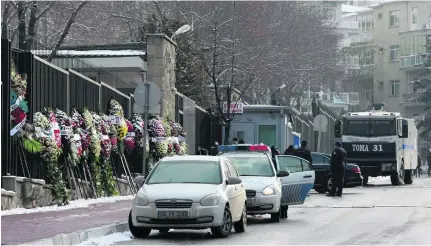  ?? Adem Altan / AFP ?? Flowers are left on the the road leading to the Russian embassy in Ankara two days after Russia’s ambassador was murdered.