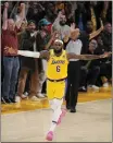  ?? MARK J. TERRILL — THE ASSOCIATED PRESS ?? Lakers forward LeBron James celebrates after scoring to pass Kareem Abdul-Jabbar to become the NBA's all-time leading scorer on Tuesday in Los Angeles.