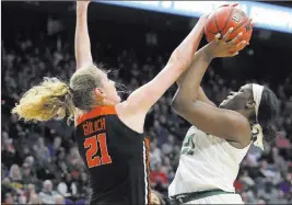  ?? James Crisp ?? The Associated Press Oregon State center Marie Gulich blocks a shot by Baylor center Kalani Brown in the third quarter of the Beavers’ 72-67 win Friday.