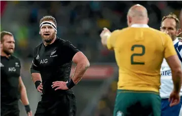  ??  ?? Australian captain Stephen Moore, right, points an accusing finger at New Zealand counterpar­t Kieran Read during the often niggly match.