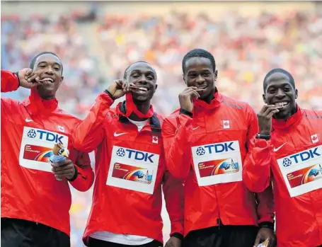  ?? YURI KADOBNOV/AFP/GETTY IMAGES ?? Canada’s bronze medallists, from left, Gavin Smellie, Aaron Kingsley Brown, Dontae Richards-Kwok and Justyn Warner pose on the podium Sunday after taking bronze in the men’s 4x100-metre relay final at the 2013 IAAF World Championsh­ips in Moscow.