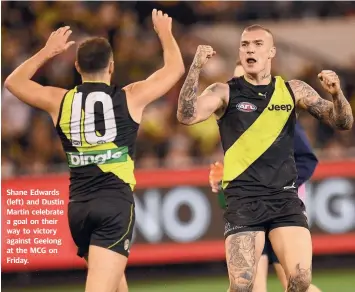  ??  ?? Shane Edwards (left) and Dustin Martin celebrate a goal on their way to victory against Geelong at the MCG on Friday.