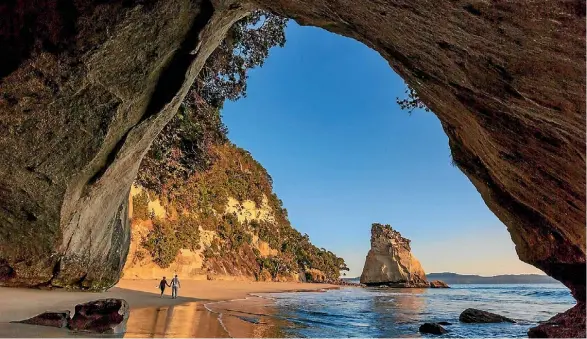  ??  ?? Pressure on popular locations, such as Coromandel’s Cathedral Cove, is driving calls for a $130 million fund for tourism facilities.