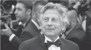  ?? VALERY HACHE/AFP/GETTY IMAGES ?? Fugitive movie director Roman Polanski plans to return to the United States, his lawyer said Thursday, and is seeking assurances he will do no further jail time over the statutory rape of a 13-year-old girl.