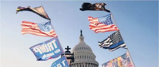  ?? JACQUELYN MARTIN/AP ?? Flags fly near the U.S. Capitol as supporters of President Donald Trump attend marches Saturday in Washington.