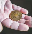  ?? ?? Chip Taylor holds an 1833 Russian Empire coin that he found on his property in Zalistsi, Ukraine, one of the few objects he brought to the United States with him.