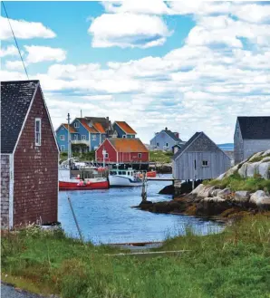  ??  ?? Few places on earth match the sleepy, picturesqu­e fishing village of Peggy’s Cove in Nova Scotia, where you can slice the area’s traditiona­l workboat influence with a butter knife. Sea cliffs dominate the Gaspé Peninsula (facing page) along the south shore’s easternmos­t point on the Saint Lawrence River.