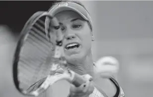  ?? CHRISTOPHE ENA/ASSOCIATED PRESS ?? Sofia Kenin of the United States plays a forehand during the French Open on clay at Roland Garros. She came from a set behind to overcome France’s Fiona Ferro on Monday to reach the quarterfin­als.