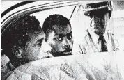  ?? THE ADVOCATE VIA THE ASSOCIATED PRESS ?? Henry Montgomery, flanked by two deputies, awaits the verdict in his 1964 trial for fatally shooting sheriff’s Deputy Charles H. Hurt in Louisiana.