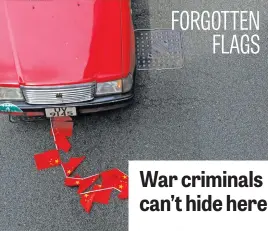  ?? Picture: Reuters ?? Chinese flags on the ground during a march against national security law at the anniversar­y of Hong Kong’s handover to China.