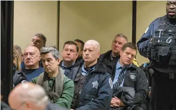  ?? CHICAGO TRIBUNE ?? Law enforcemen­t officers attend a Jackie Wilson hearing on Jan. 16, 2018, when he was seeking a new trial.