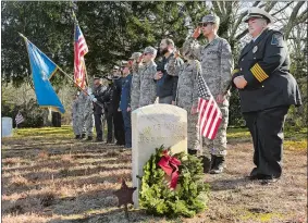  ?? DANA JENSEN/THE DAY ?? From right, Chief Rachael Jones of the Westerly Ambulance Corps, and members of the Civil Air Patrol, Coast Guard, Navy and Stonington Police stand at attention while taps is performed Saturday during the Wreaths Across America ceremony at Stonington Cemetery. A total of 147 wreaths were laid on veterans’ graves at the cemetery.