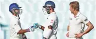  ?? – PTI ?? CRUCIAL STAND: India’s Cheteswar Pujara and Ajinkya Rahane greet each other as New Zealand’s Neil Wagner looks on during first day of their second Test at Eden Garden in Kolkata on Friday.