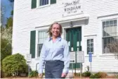  ?? MICHAEL CASEY/AP ?? Kristi St. Laurent, who ran for a New Hampshire state House seat in 2020, stands Friday in front of Town Hall in Windham, N.H.