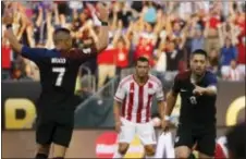  ?? MATT ROURKE — THE ASSOCIATED PRESS ?? The United States’ Clint Dempsey (8), Bobby Wood (7) and Paraguay’s Miguel Samudio (6) react after Dempsey’s goal Saturday in Philadelph­ia.