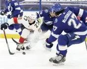  ?? CHRIS O'MEARA AP ?? Panthers center Eetu Luostarine­n tries to push the puck past Lightning defenseman Ryan McDonagh.