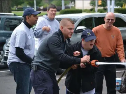  ?? DORI ANN MILES — FOR DIGITAL FIRST MEDIA ?? Limerick Fire Company held its first Firefighte­r Day Camp for individual­s with special needs on Oct. 13. Campers got the chance to take a look at and learn how to use fire equipment and take a tour of the firehouse.