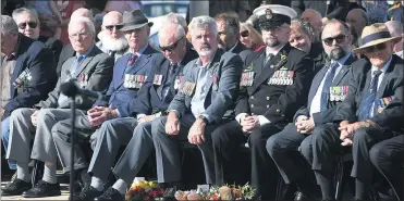  ??  ?? REFLECTION: Anzac Day commemorat­ion services in Ararat attracted a broad cross section of the community, with everyone from former and current servicemen and servicewom­en and representa­tives from various organisati­ons to families and everyday people...