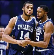  ?? GARY LANDERS / AP ?? Mikal Bridges (right, withOmari Spellman) scored 25 points in Villanova’s 95-79 road win. The Wildcats trail the Musketeers by a half-gamein the Big East.